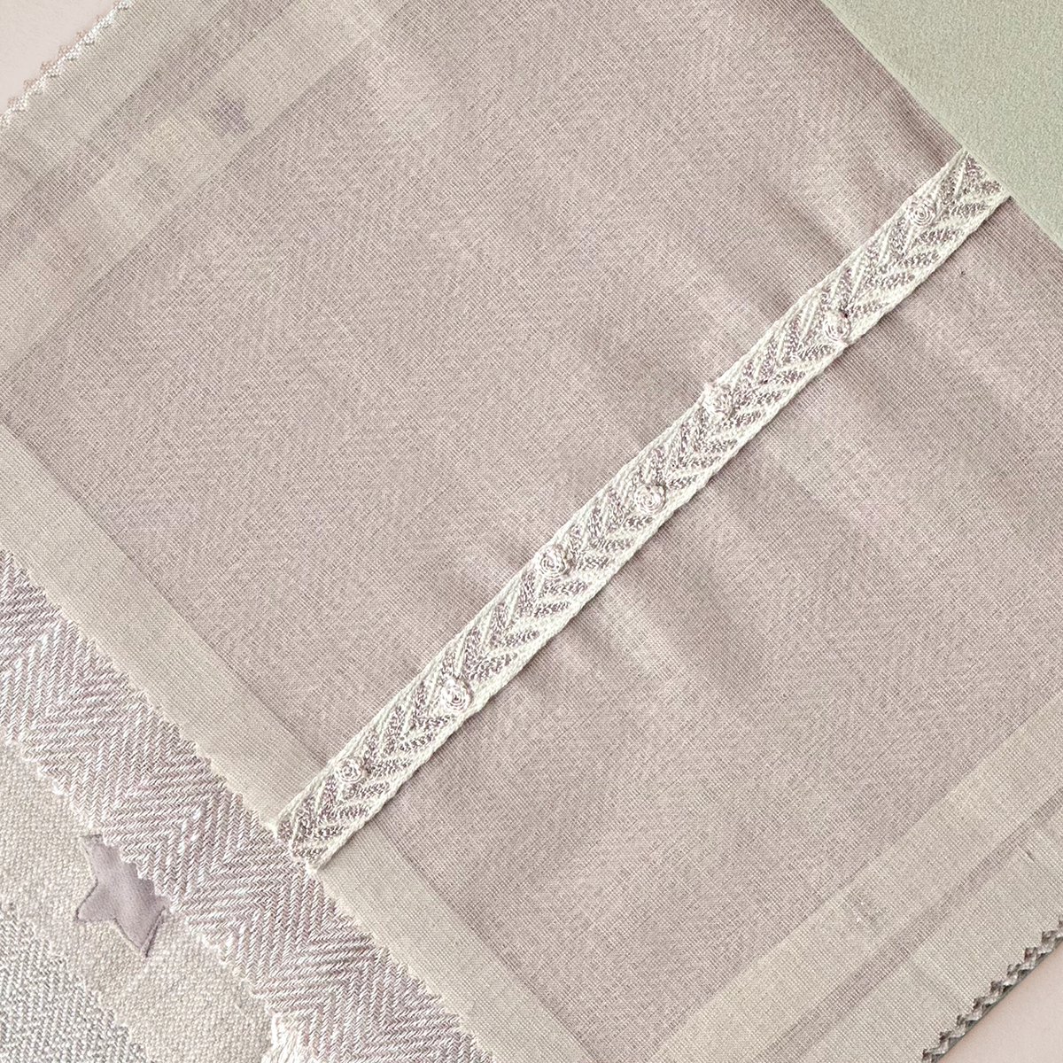 Delicate Lace-Trimmed Textile